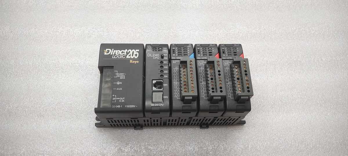 KOYO DIRECT LOGIC 205 PLC D2-04B-1 PS D2-240 CPU D2-16ND3-2 IN D2-12TR OUT