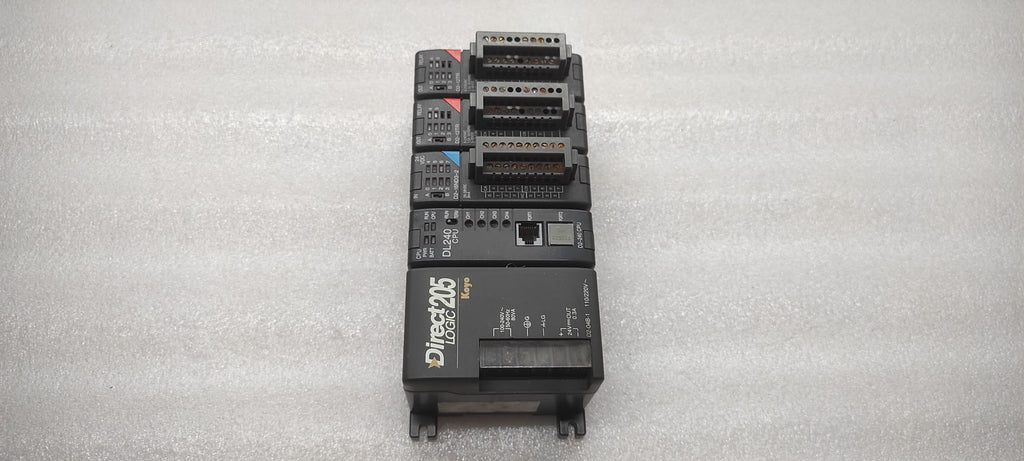 KOYO DIRECT LOGIC 205 PLC D2-04B-1 PS D2-240 CPU D2-16ND3-2 IN D2-12TR OUT