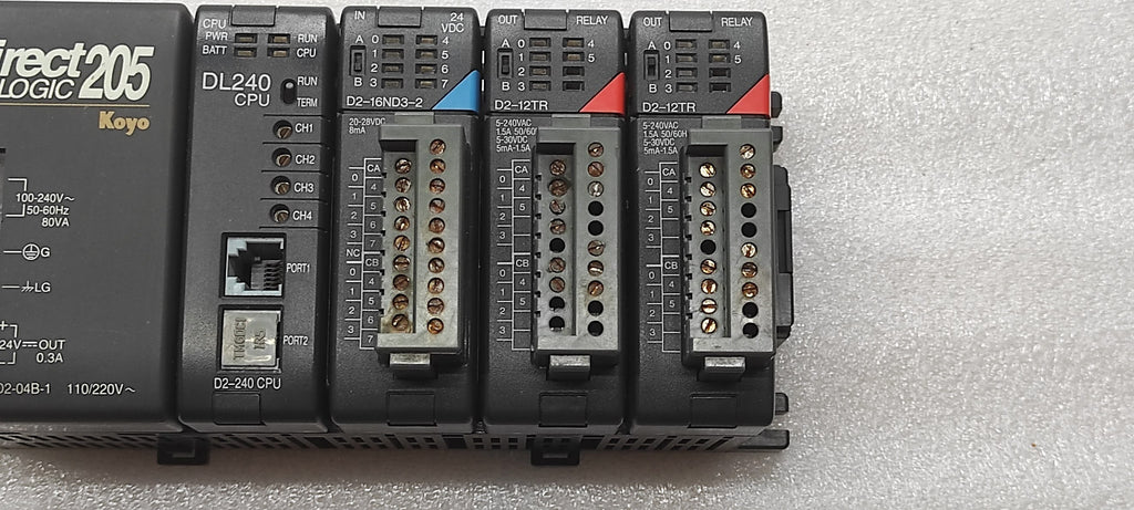 KOYO DIRECT LOGIC 205 PLC D2-04B-1 PS D2-240 CPU D2-16ND3-2 IN D2-12TR OUT
